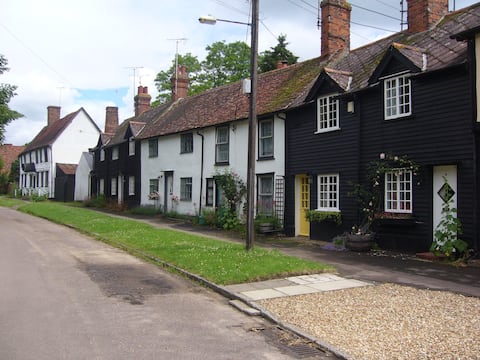 Clapboard cottage with garden