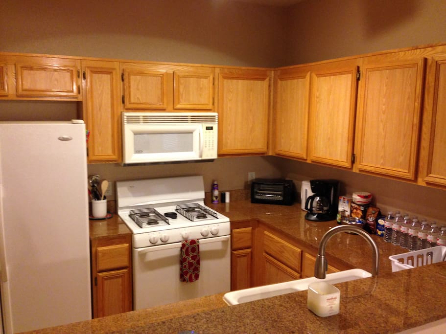 Fully stocked kitchen! Dishwasher, fridge, fire top range, gas oven, coffee maker, toaster, pots, pans, cutting board, silverware, plates, bowls, cups, mugs and so much more to make you feel at home!