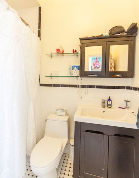 Clean bathroom with Toto toilet and tub.