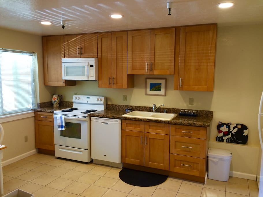 new kitchen with granite and appliances