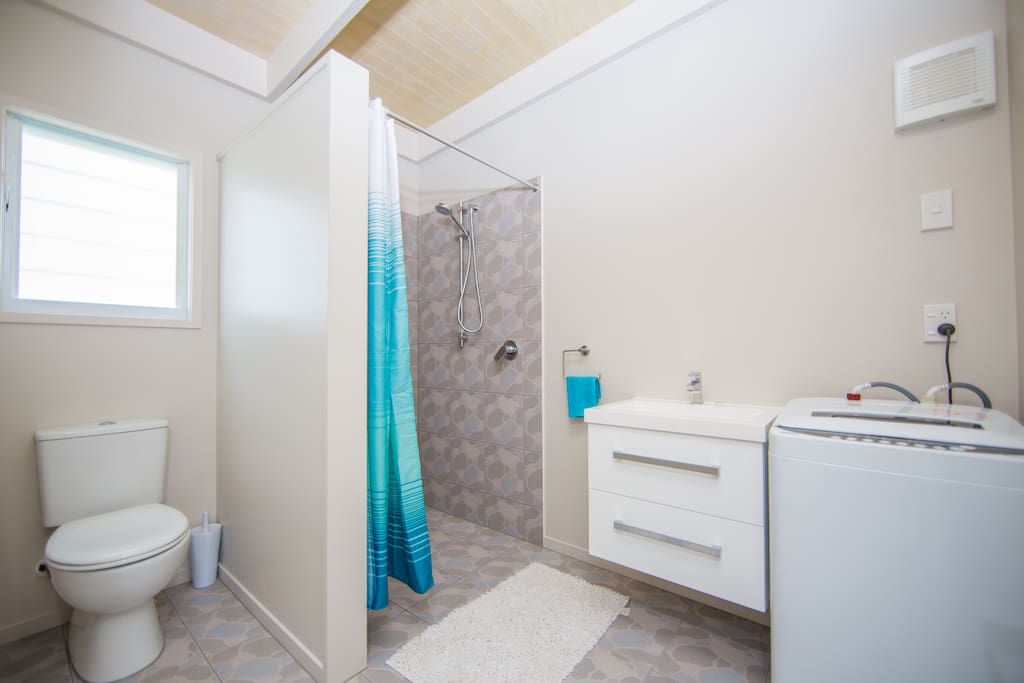 Bathroom with washing machine.