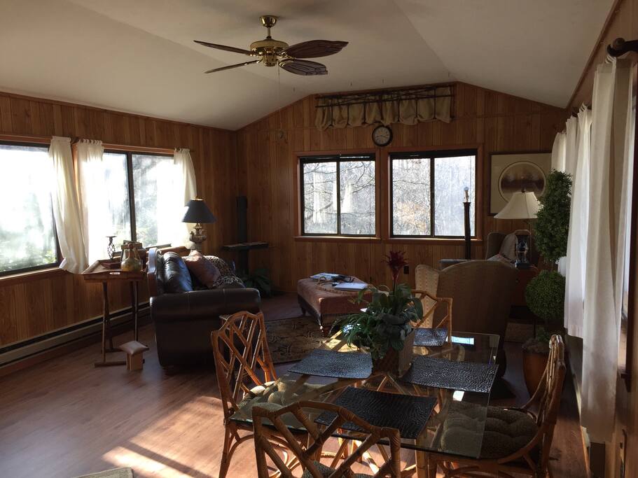 Sunlight filled great room...Leather desk is tucked in the corner with plenty of usb connections