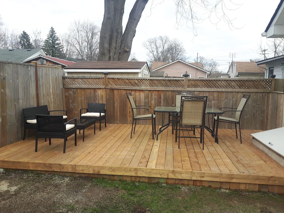 New spacious deck with dining and seating area.