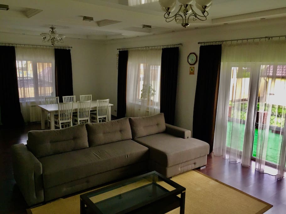 Living room on the first floor with wardrobe and big sofa, can accommodate 2-3 people.