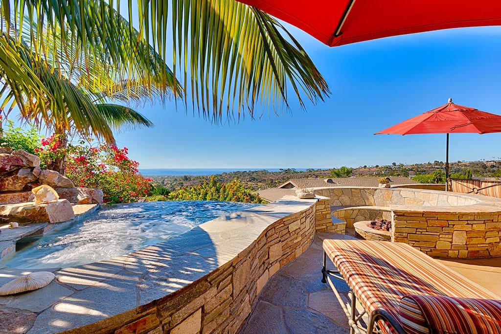 Stone and Tile Back Patio with Ocean Views, Hot Tub, and Fire Pit