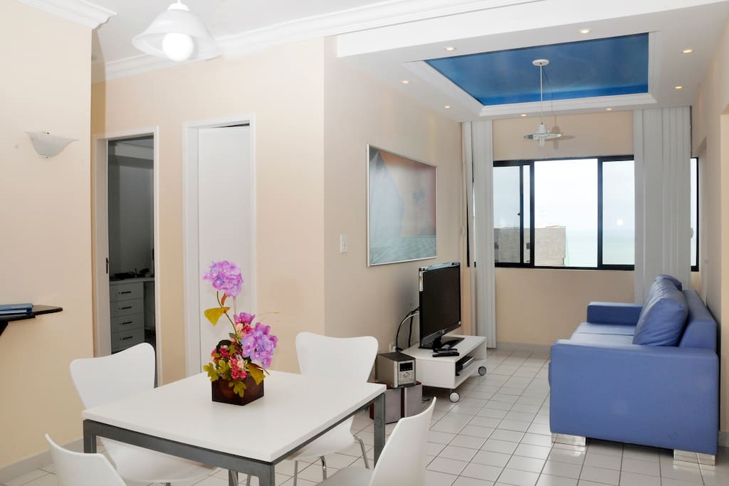 Great eating area and open space which leads to a living room with flat-screen TV!