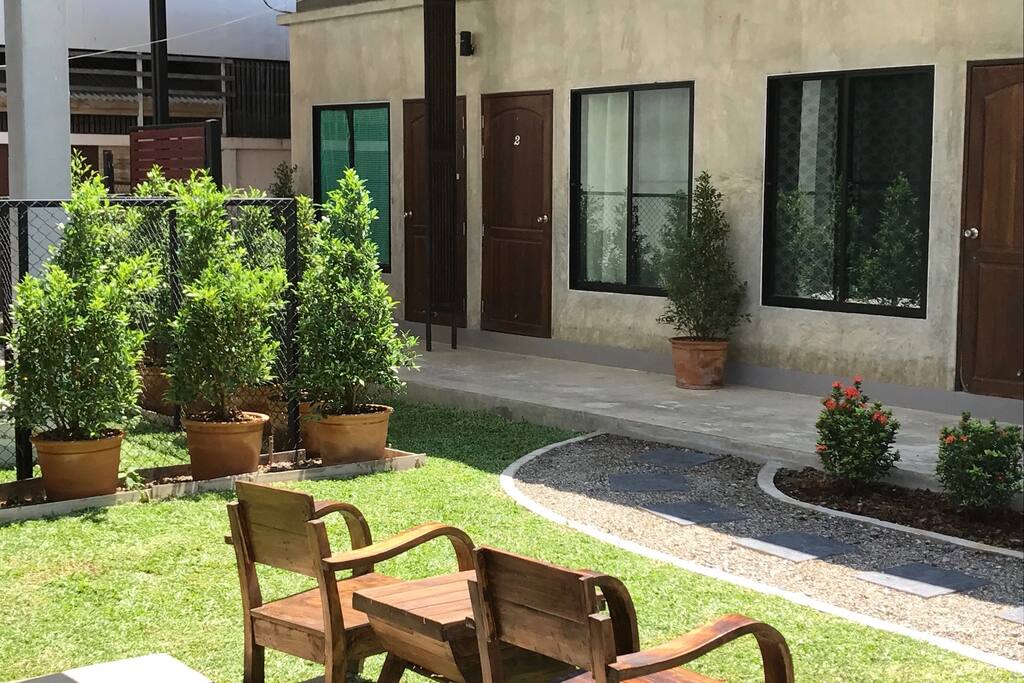 Shared outdoor area with seats and tables.
