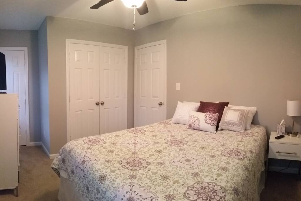 Two closets, a dresser, and a nightstand.