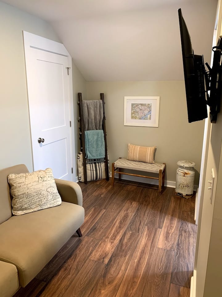 There is a living space complete with a second sleeper sofa and TV.