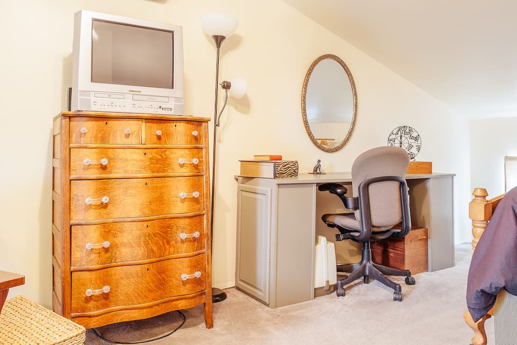 Another view of the loft, with TV (Dish Network), and custom desk.