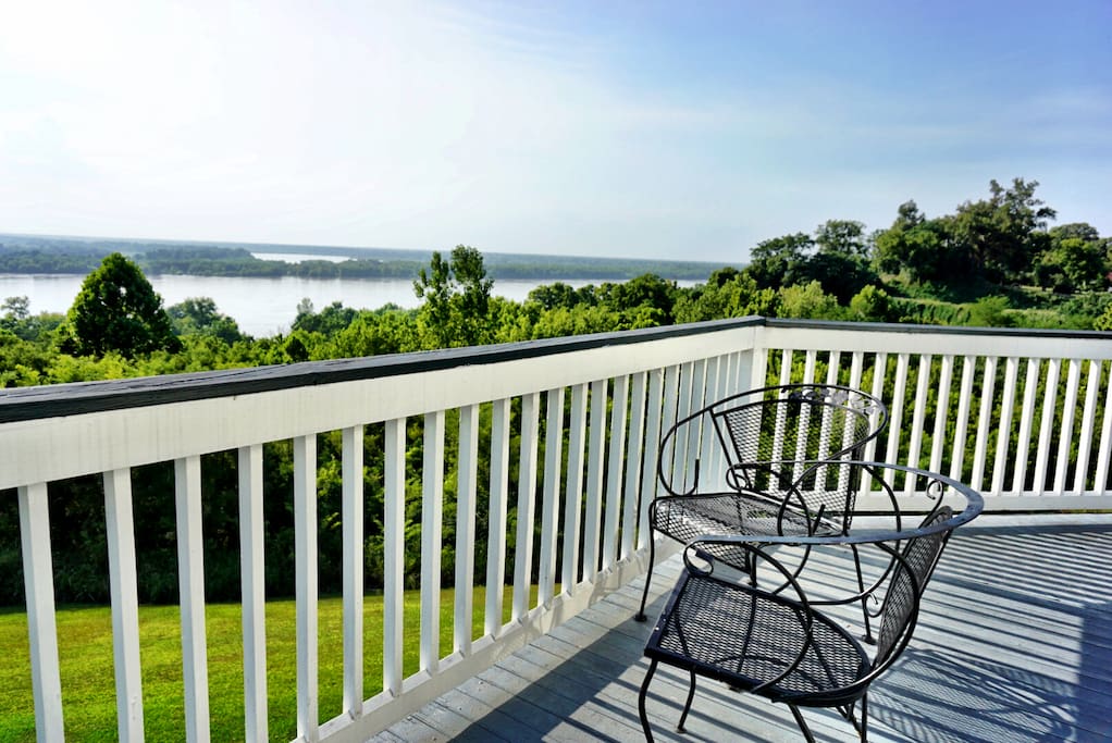 Our 2nd-floor veranda has a panoramic view of the Mississippi River -- all the way from the Vidalia Bridge -- to Huck Finn's wilderness to the north.