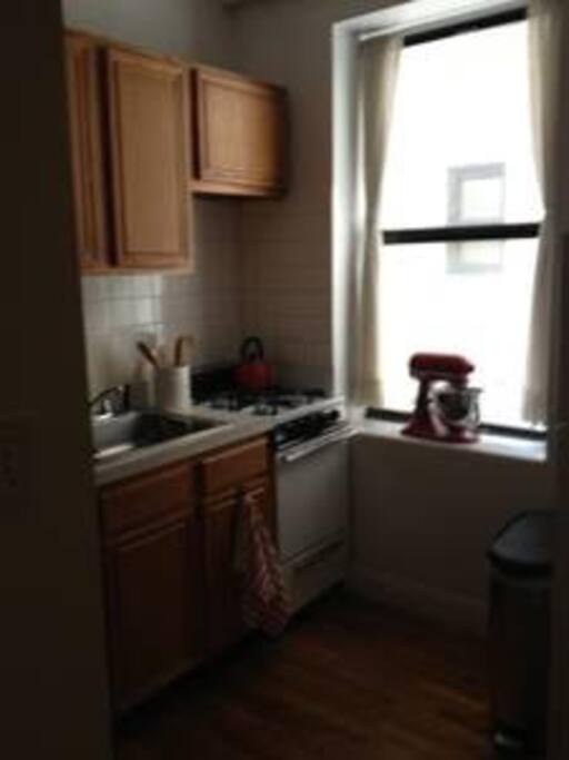 Kitchen - includes stove top, cutlery, cooking utensils, fridge, etc