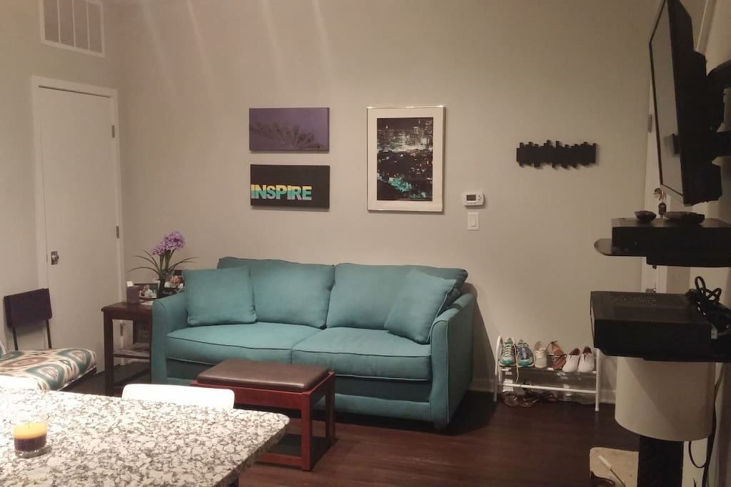 Couch pulls out to queen bed.