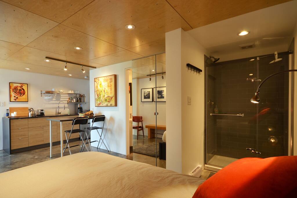 Large tempered glass shower, mirrored wardrobe and powder room