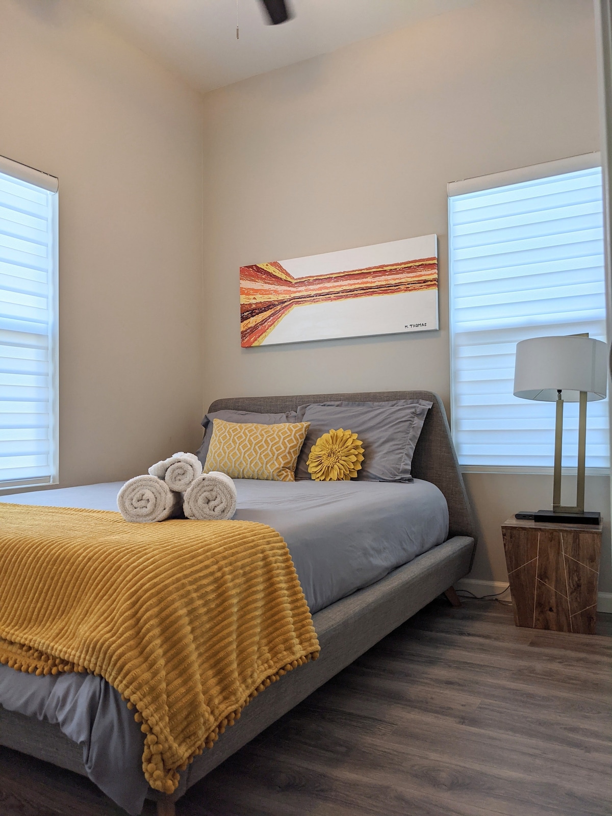 Ready to rest? Sweet dreams in this cozy bedroom with tall ceilings and a queen memory foam mattress. 