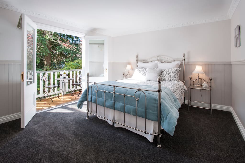 The Stables main bedroom opens to a private deck.