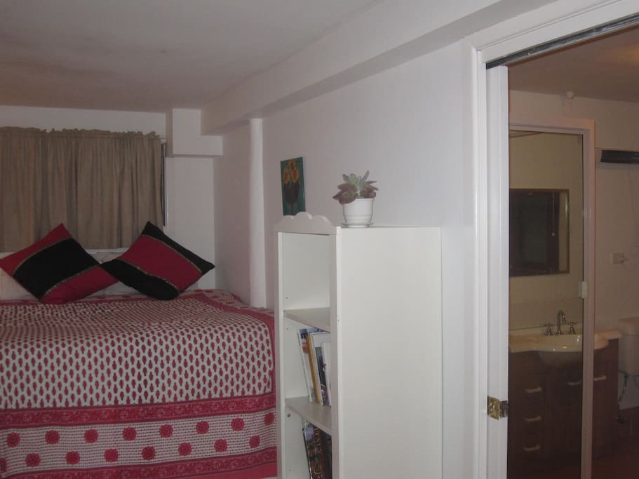Mezzanine bed area and entrance to Bathroom/laundry