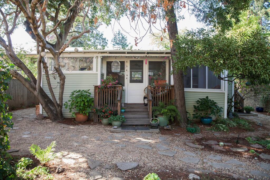 Our charming cottage under the trees.