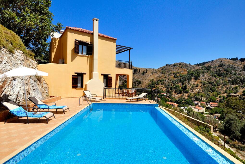 Pool view from BBQ to villa and village in background