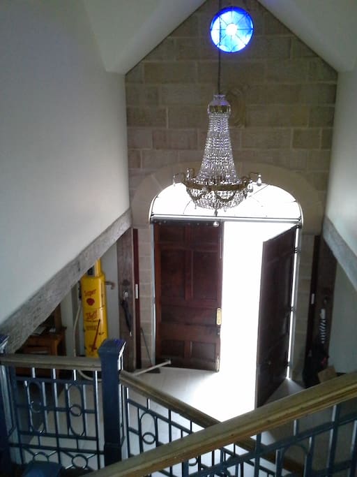 view of entrance from staircase landing