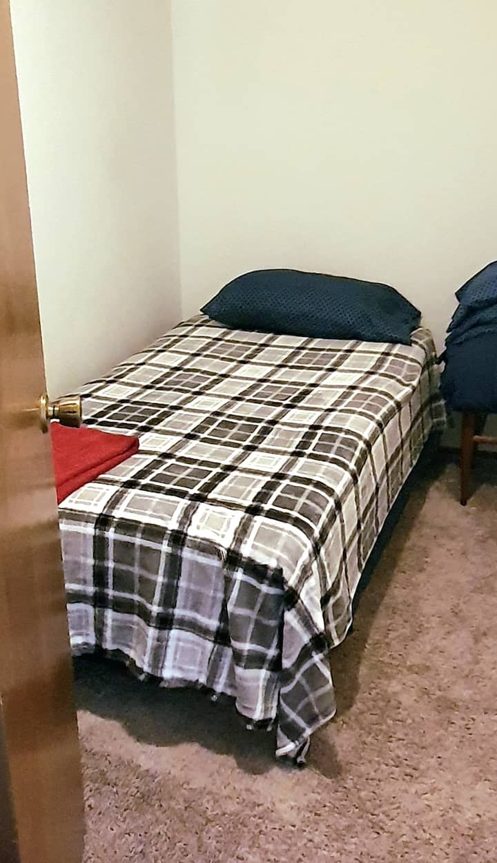 Extra single bed in an attached room. 