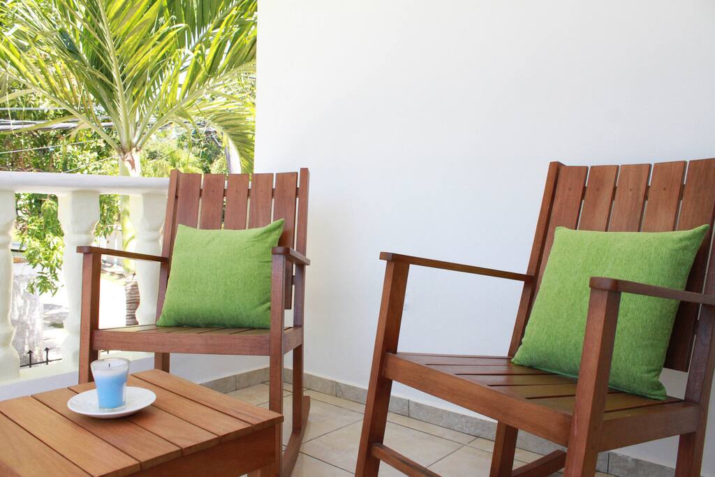 Balcony with rocking chairs.