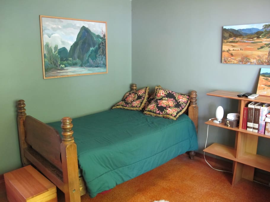 An antique bed (six feet long) is very comfortable if you're under six feet! Original art is featured throughout the house