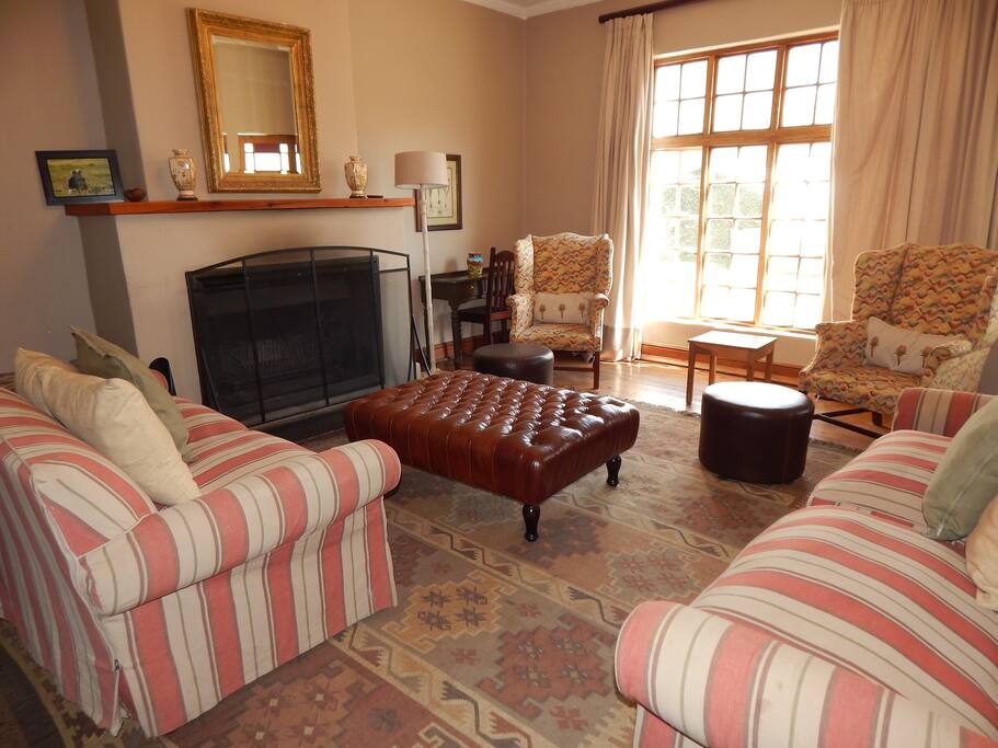 Colonial lounge with large fireplace.