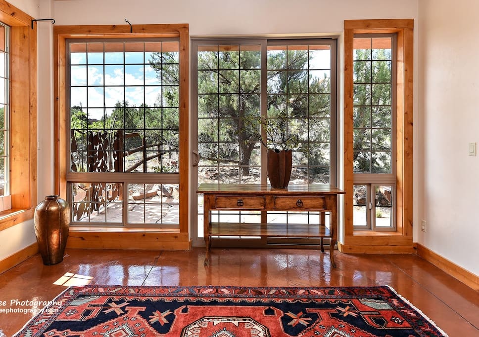 Floor to Ceiling windows greet you in foyer.