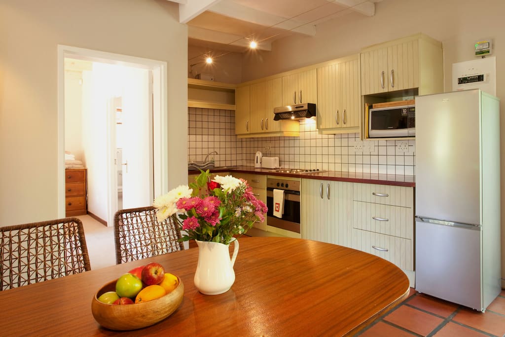 The bedroom leads off the kitchen/dining area.
