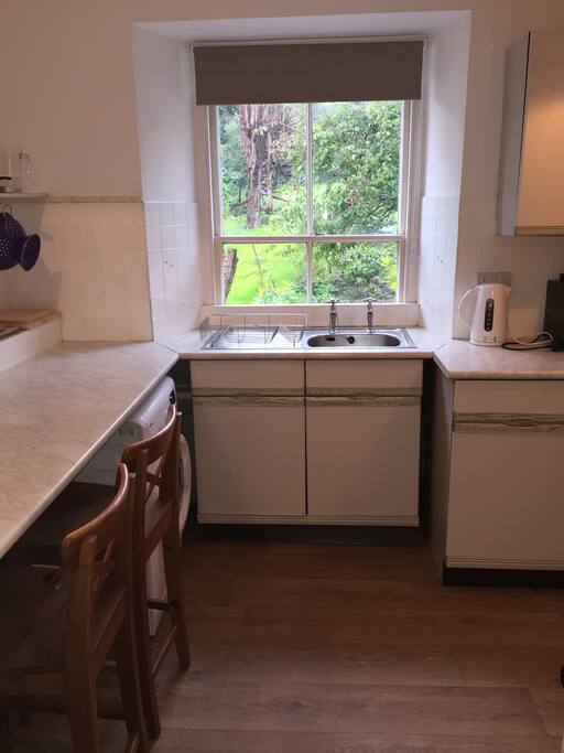 Kitchen includes washing machine, fridge/freezer, microwave and oven/hob
