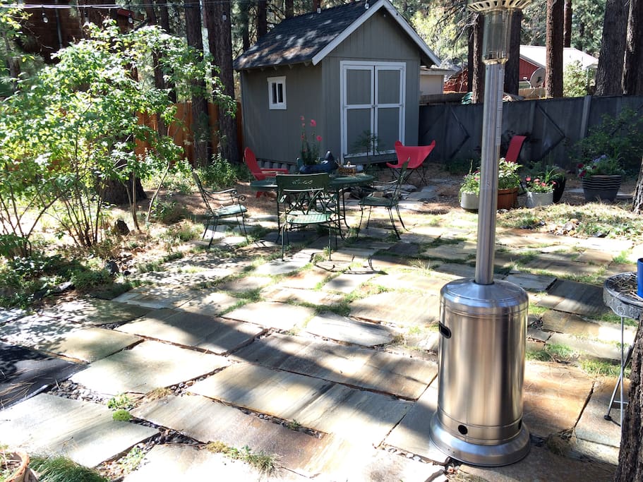 Stone patio backyard with BBQ.