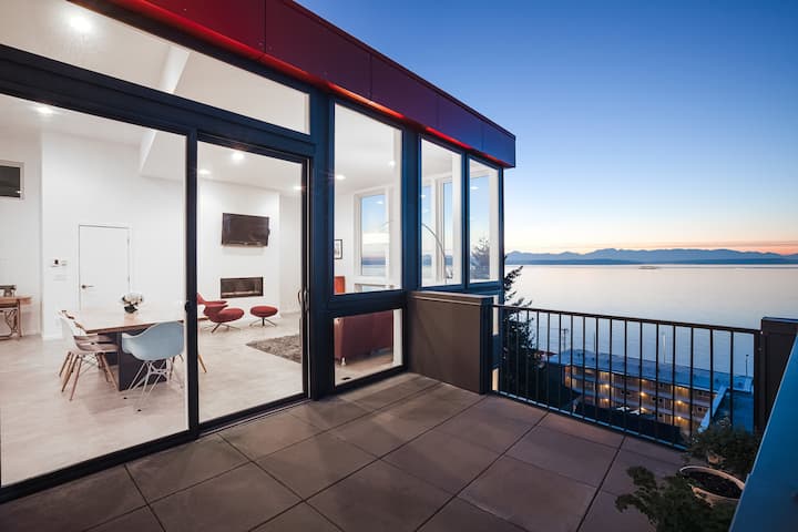 Architectural Modern Home situated a block from Alki Beach with stunning views of Puget sound/ocean and the Olympic Mountains. Views can be seen from every floor of this home. Home consists of floor to ceiling windows to enjoy every bit of the view.