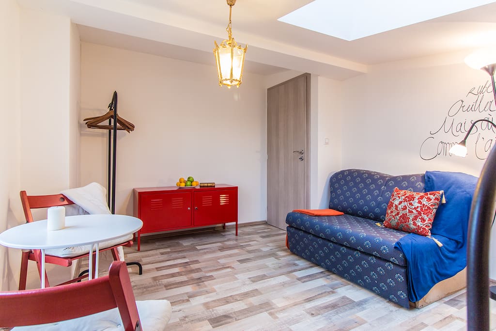 Comfortable convertible sofa bed in every room, in case extra sleeping places needed.
Artistic touch at the wall: hand calligraphy of Charles Baudelaire poetry by talented local artist.