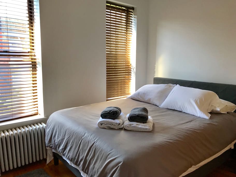 True queen size bed in comfortable bedroom