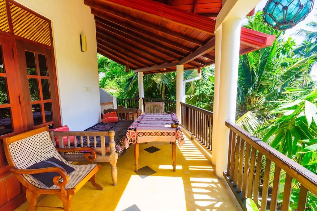 spacious balcony facing garden with dining table to enjoy your dinner