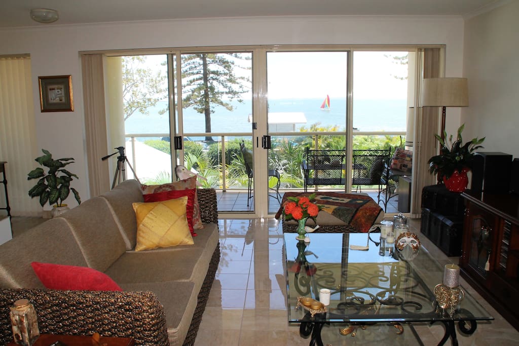 Relaxed lounge room with Moreton Bay and Esplanade views