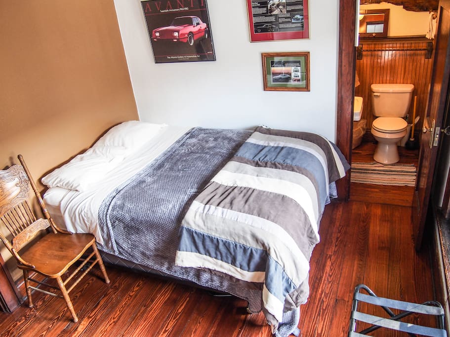 Luxurious queen sized bed in one room.