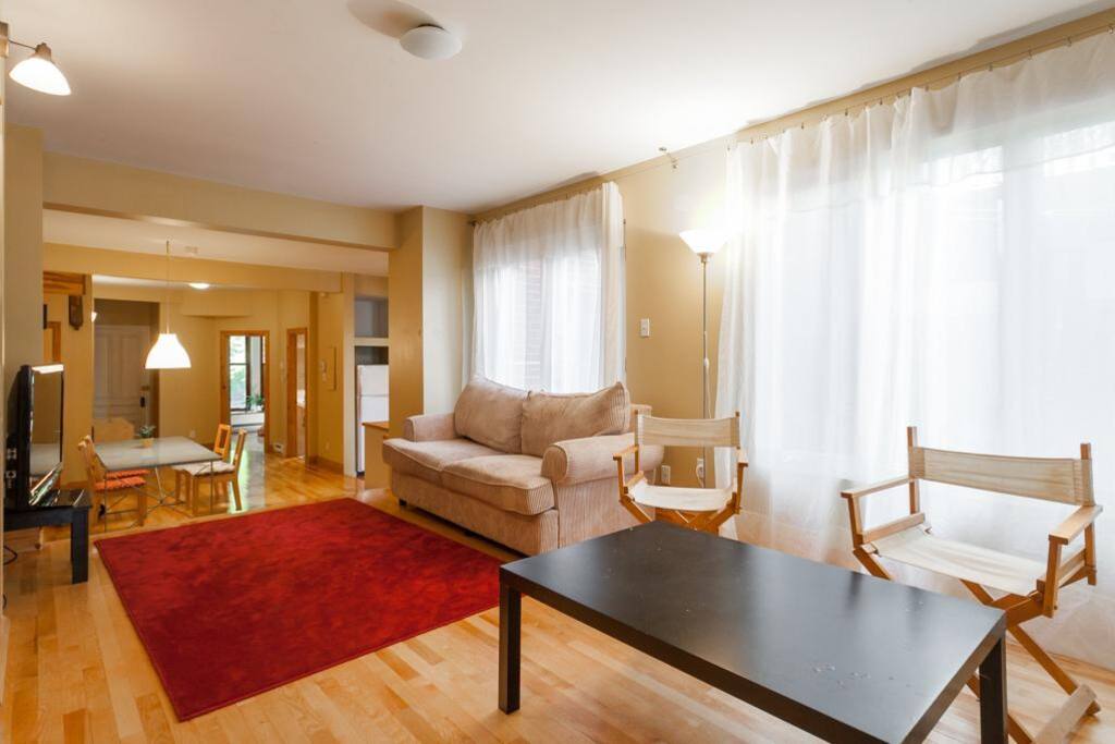Living Room with pull couch & reading area / Flat screen TV
