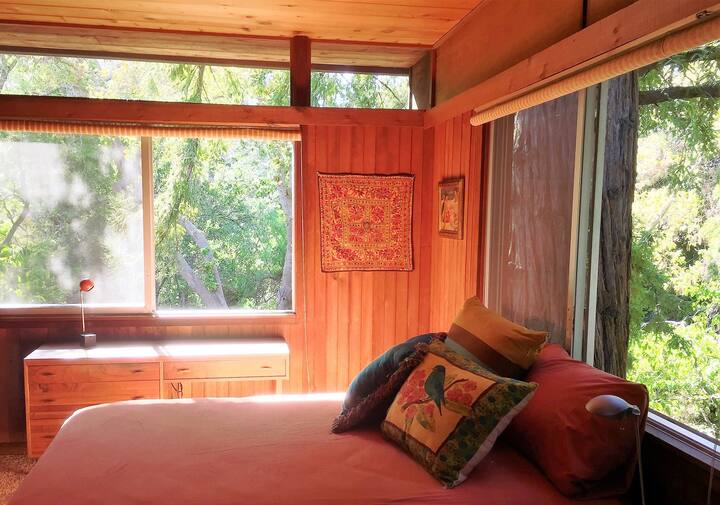 Bedroom 2: Queen bed with view of the creek and San Luis Mountain