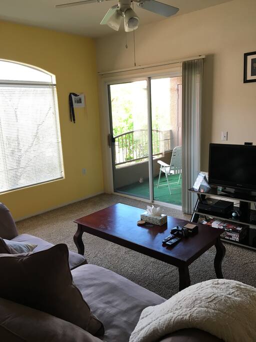 Living area with TV and balcony