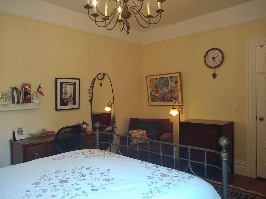 A comfortable area to sit, a desk and dresser - all fitting with the Victorian ambiance