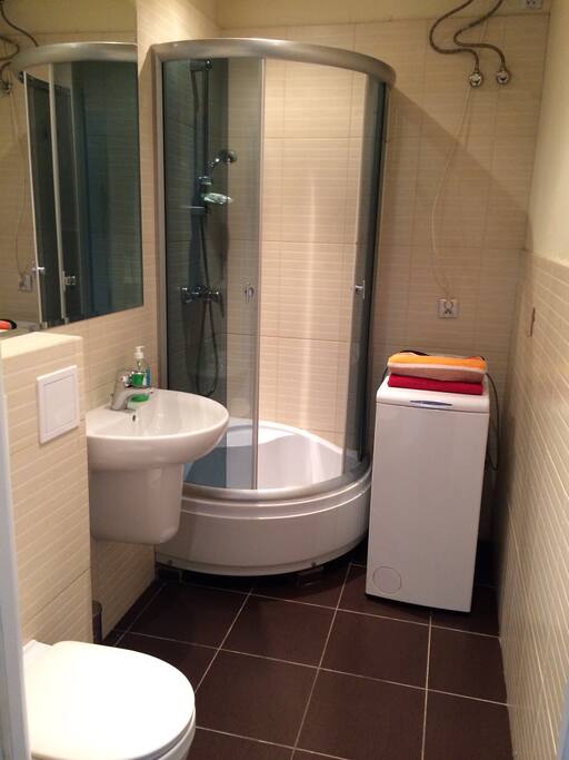 Fresh and recently renovated bathroom. Washing mashine.