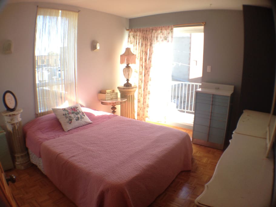 Your bedroom! Lots of sunlight. Doors to private balcony.