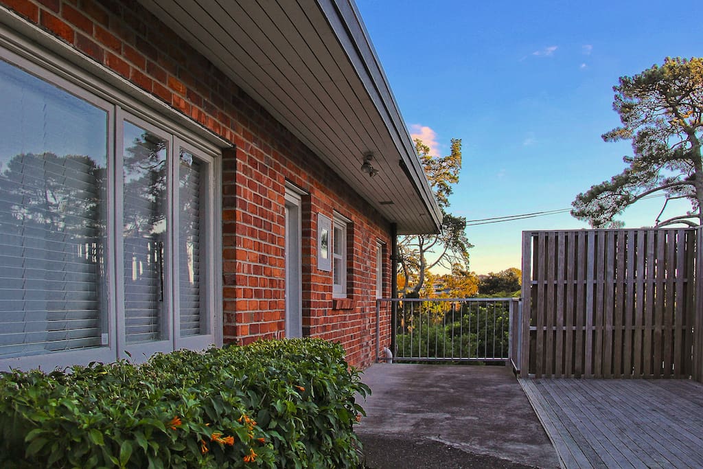 The front door and deck area of the house