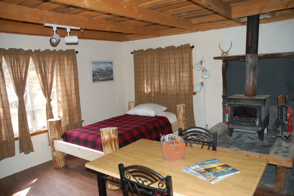 Tranquility Cabin rustic beds with wool plaid
