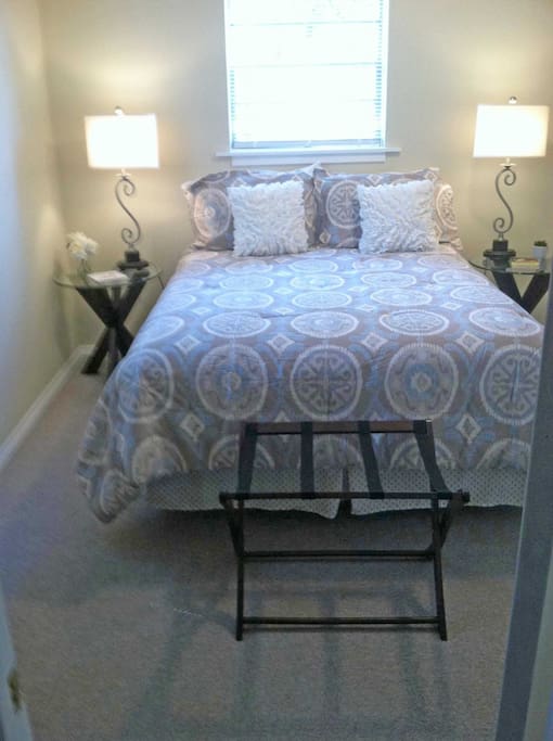 Queen size bed with firm mattress.