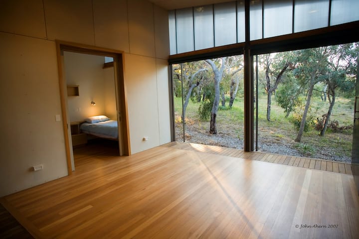 Doors open fully as a “balcony” to the bushland below