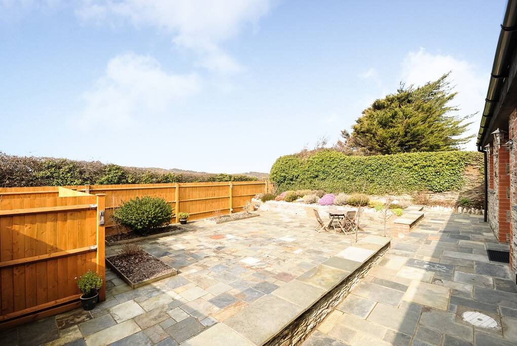 Large secluded suntrap patio.