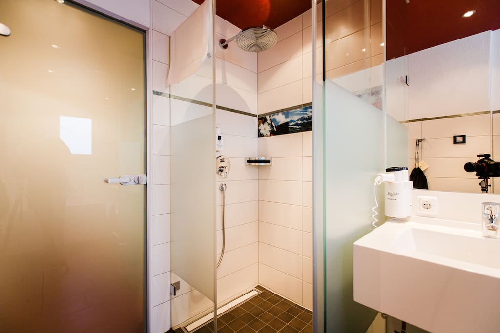 Bahroom with rain shower and separate toilet